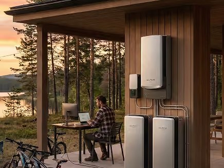 Home battery system mounted on a wall, keeping a home office powered