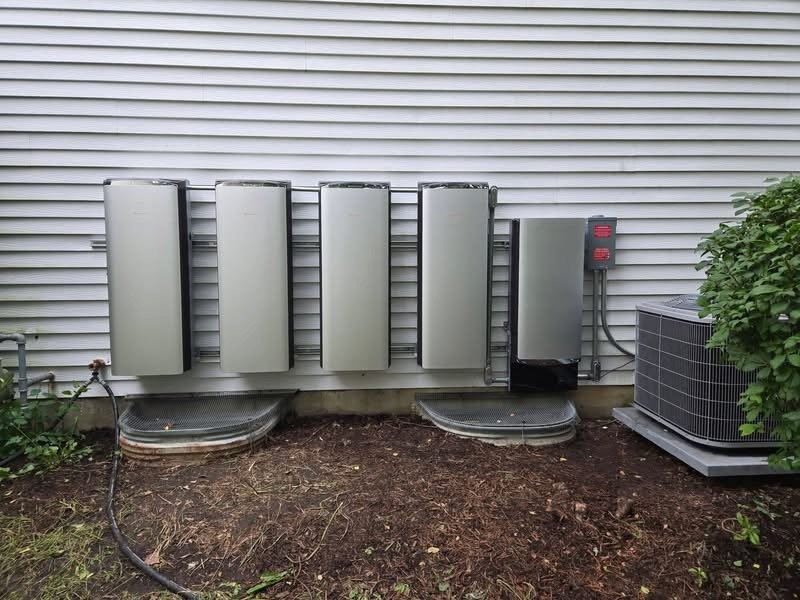 Home battery system installed on the side of a customer's house